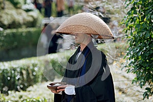 Buddhist monk begging and chanting