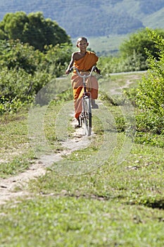 Buddhist monk on bicycle