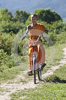 Buddhist monk on bicycle