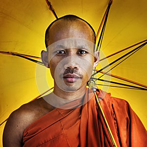 Buddhist monk holding umbrella Ceremony Concept