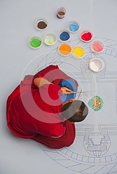 Buddhist monk making sand mandala