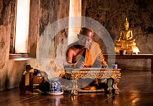 Buddhist monk reading book