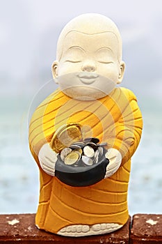 Buddhist monk sculpture for receive food money