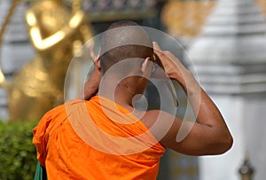 Buddhist Monk Taking a Photo