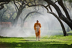 Buddhist monk walk receive food in the morning photo
