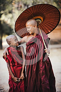 Buddhist monks. Friends.Smiling kids.
