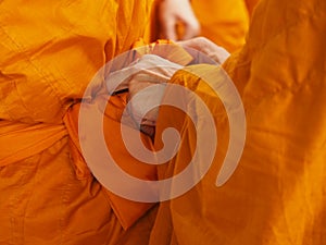 Buddhist novice thailand with yellow robe of buddhist monk