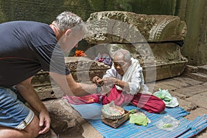 Buddhist nun in temple, Angkor Wat, Cambodia