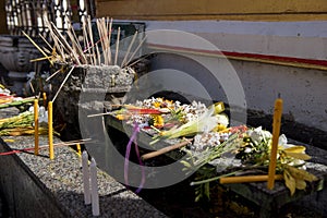 Buddhist people put the flower ,joss stick ,candle and lotus on the table after pray for pagoda Tak ,Thailand