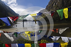 Buddhist prayer flags by the lake