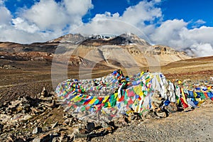 Buddhist prayer flags (lungta) on Baralacha La pass in Himalayas