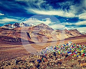 Buddhist prayer flags lungta at mountain pass in Himalayas