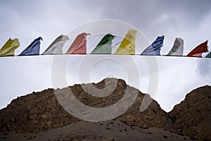 Buddhist prayer flags lungta in Spiti Valley and Ladakh. Flying prayer flags of Om Mani Padme Hum