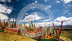 Buddhist prayer flags in the tibetan mountain landscape