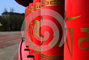 Buddhist prayer wheels of red color