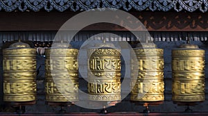 Buddhist prayer wheels rotating in motion
