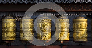 Buddhist prayer wheels rotating in motion