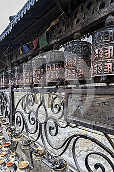 Buddhist prayer wheels at Swayambhunath Monkey temple - Kathmandu, Nepal