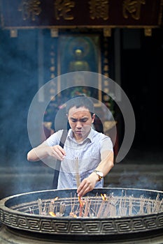 Buddhist prayers burning incense
