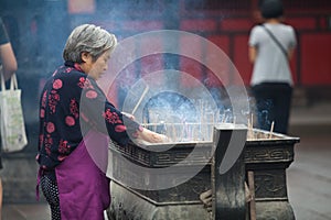Buddhist prayers burning incense