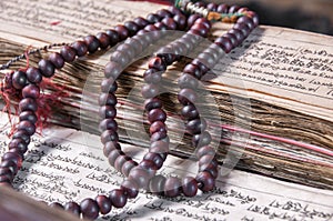 Buddhist religious japa mala on manuscript photo