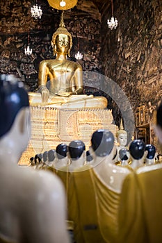 Buddhist royal temple Wat Suthat. Interiors, ornaments and the Budda sculpters or effigy. Thailand, Bangkok