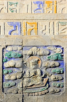 Buddhist scriptures and embossment on the rock in a temple
