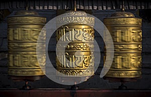 Buddhist shiny prayer wheels in motion