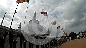 Buddhist shrine Ruwanwelisaya Sthupa in all its glory, with flags and elephants, an incredible sight