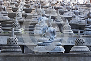 Buddhist statue in Gangaramaya Temple. Sri Lanka