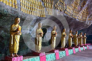 Buddhist statues row in cave