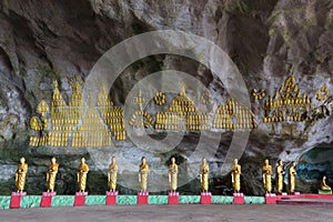 Buddhist statues row in cave