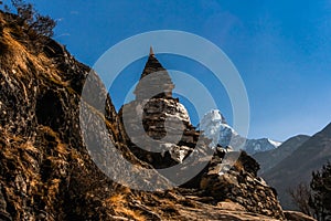 Buddhist stupa along the trail to Dingboche Pangboche and Ama Dablam mount in the background