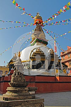 Buddhist stupa with colorful prayer flags