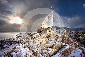 The Buddhist Stupa of Enlightenment in winter in sunny day at Ogoy Island, Baikal Lake , Russia