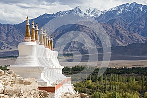 Buddhist stupa and Himalayas mountains . Shey Palace in Ladakh, India