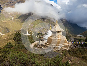 Buddhist stupa on mountain ridge.