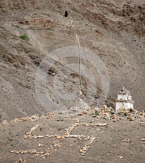 Buddhist stupa and stone swastika cross