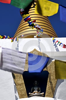 A buddhist stupa or temple, un templo budista y banderas tibetanas photo