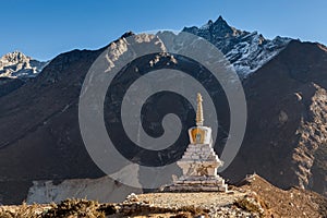 Buddhist stupa in Thame village with high rocky.