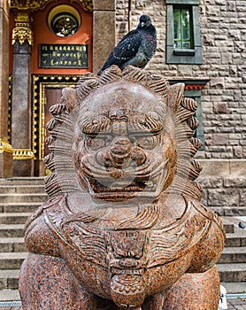 The Buddhist temple Datsan Gunzechoinei. The chinese guardian lion Foo Dog near the entrance.