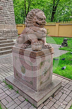 The Buddhist temple Datsan Gunzechoinei. The chinese guardian lion Foo Dog near the entrance.