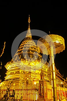 Buddhist temple golden pagoda of Doi Suthep at night