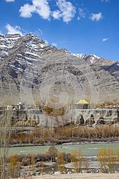 Buddhist Temple by the Indus River in Himalayas photo