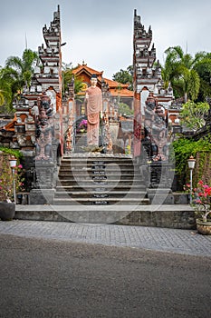 Buddhist temple in the rain. The Brahmavihara Arama Temple with beautiful gardens and monastery. Tropical plants, Banjar, Bali