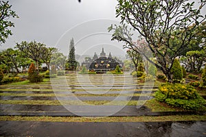 Buddhist temple in the rain. The Brahmavihara Arama Temple with beautiful gardens and monastery. Tropical plants, Banjar, Bali