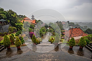 Buddhist temple in the rain. The Brahmavihara Arama Temple with beautiful gardens and monastery. Tropical plants, Banjar, Bali