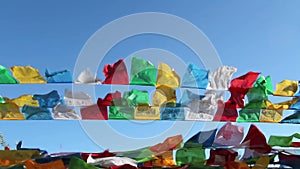 Buddhist tibetan prayer flags waving in the wind