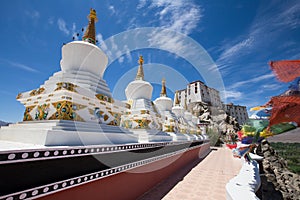 Buddhist white stupa and blue sky . Thiksey Monastery, Leh , Ladakh, India