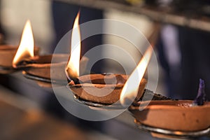 Buddhistic ritual: Burning lamp, so that a wish goes into fulfillment